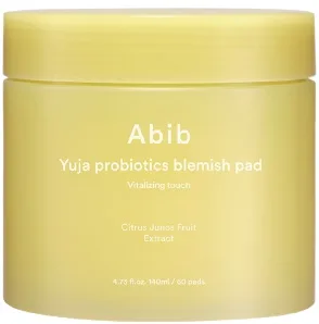 Abib Yuja Probiotics Blemish Pad Vitalizing Touch jar with yellow label and stacked cotton pads