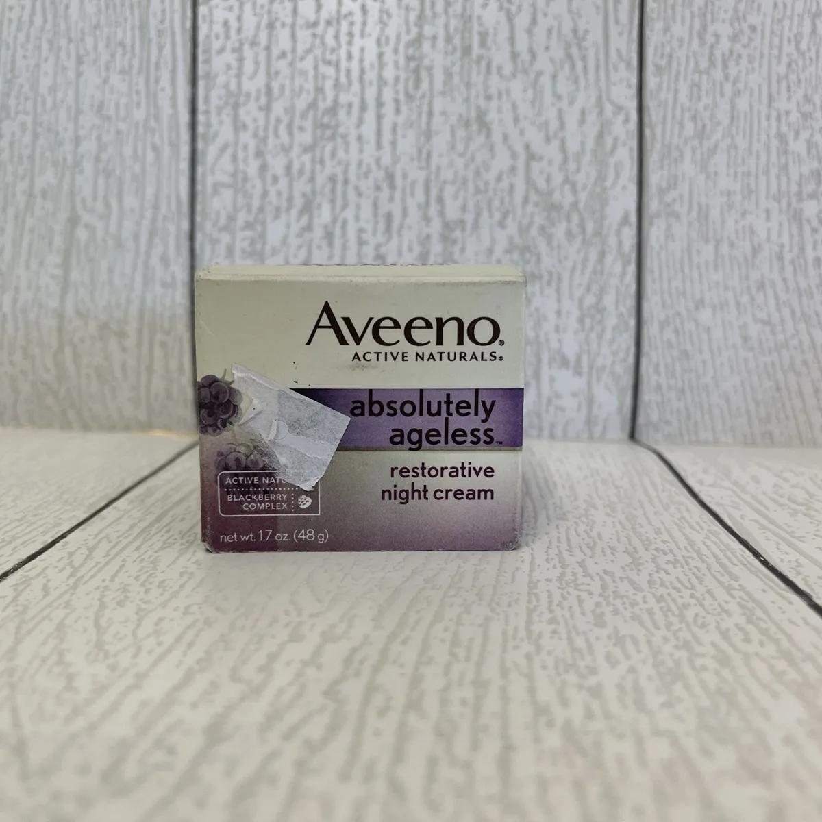 Aveeno Absolutely Ageless Restorative Night Cream 1.7 oz jar with purple and white packaging