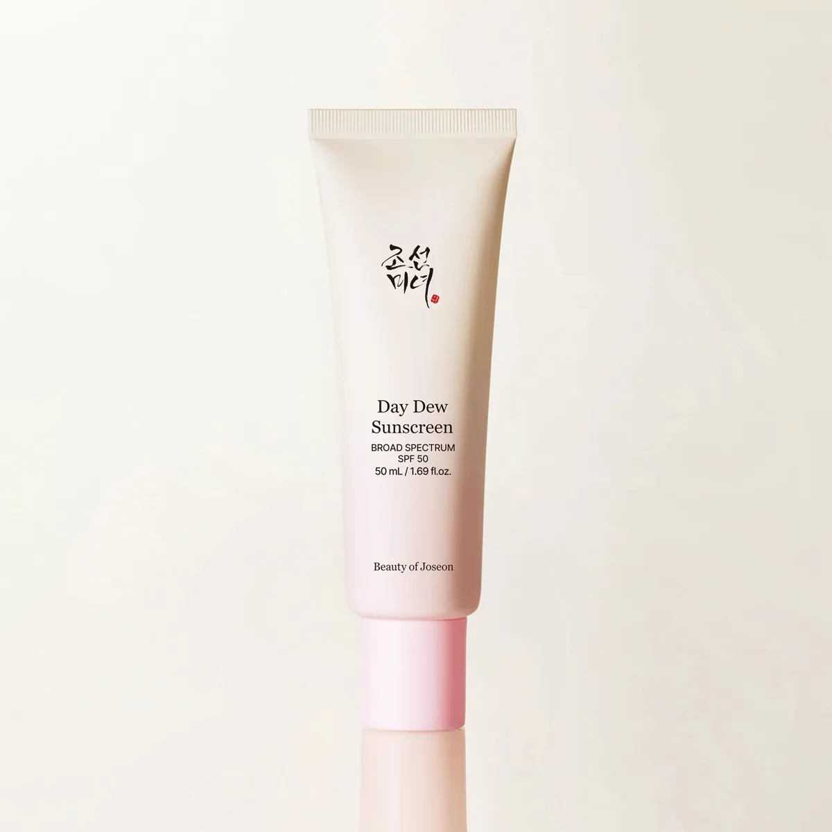 Beauty of Joseon Day Dew Sunscreen SPF 50 in a slim white tube with gold accents