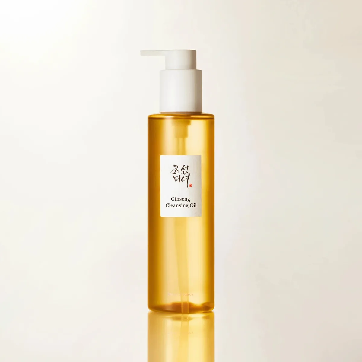 Beauty of Joseon Ginseng Cleansing Oil in a clear pump bottle showing the golden-tinted oil