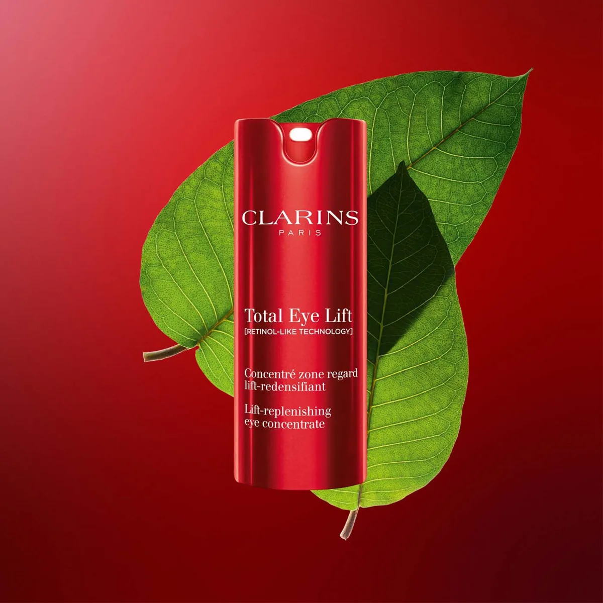 Clarins Total Eye Lift firming eye cream in signature red and white packaging with airless pump