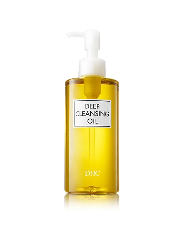 DHC Deep Cleansing Oil in a clear pump bottle showing the golden oil inside