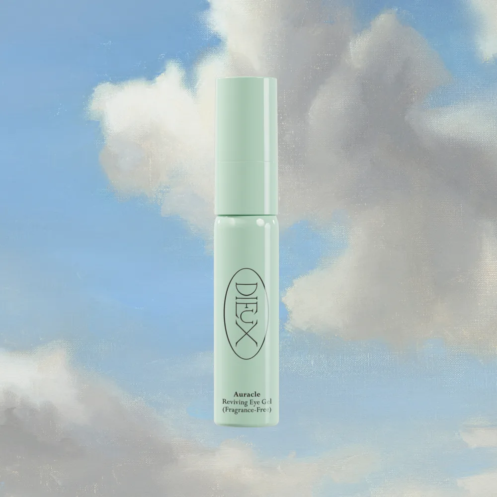 Dieux Skin Auracle Eye Serum in frosted glass bottle with glass pipette.