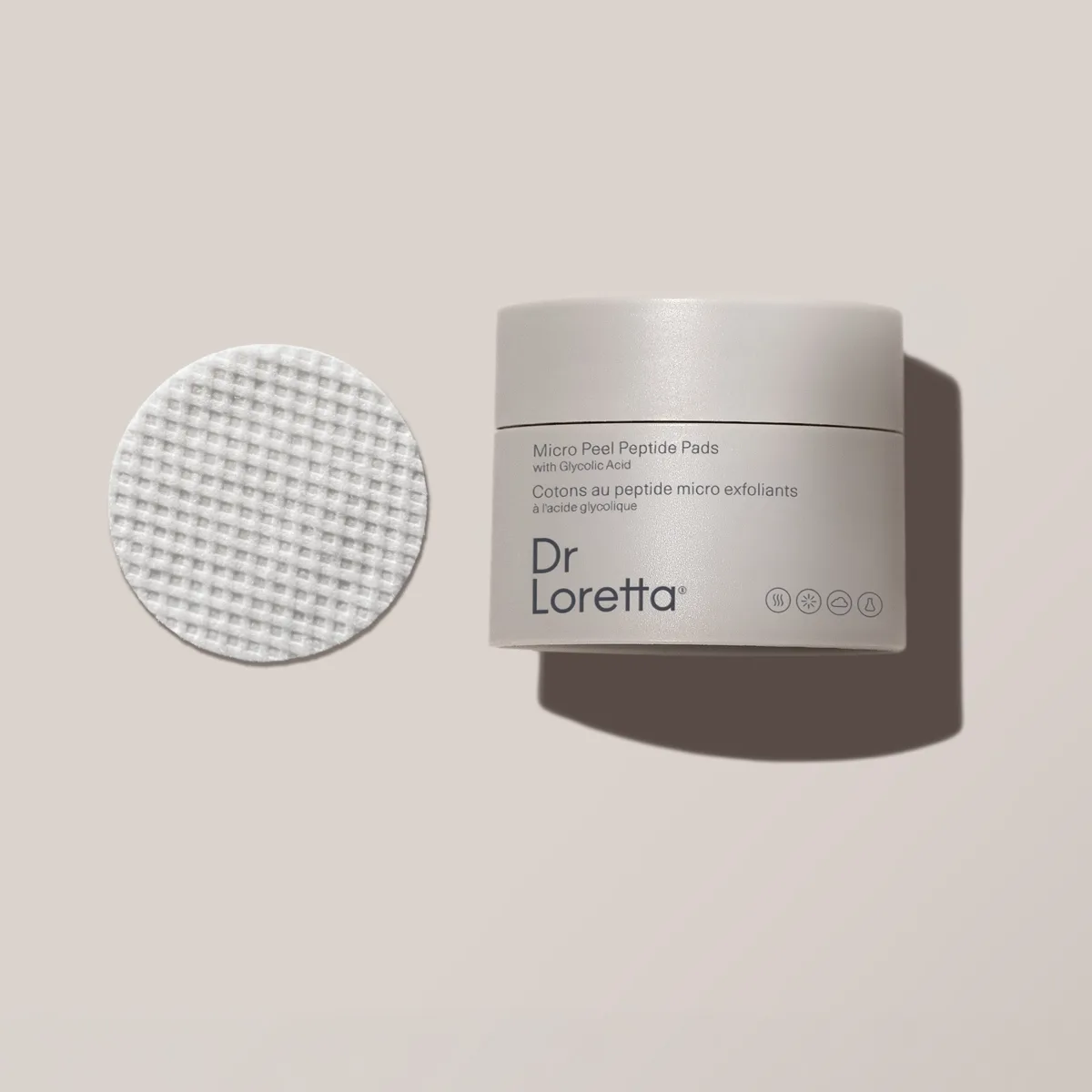 Frosted glass jar of Dr. Loretta Micro-Peel Peptide Pads containing 50 pre-soaked exfoliating pads