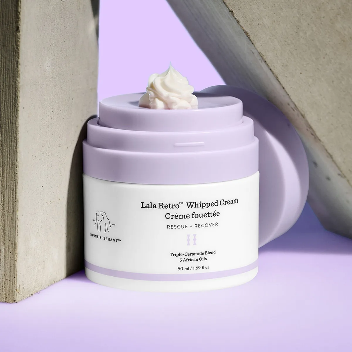 Drunk Elephant Lala Retro Whipped Cream in green refillable airless pump jar