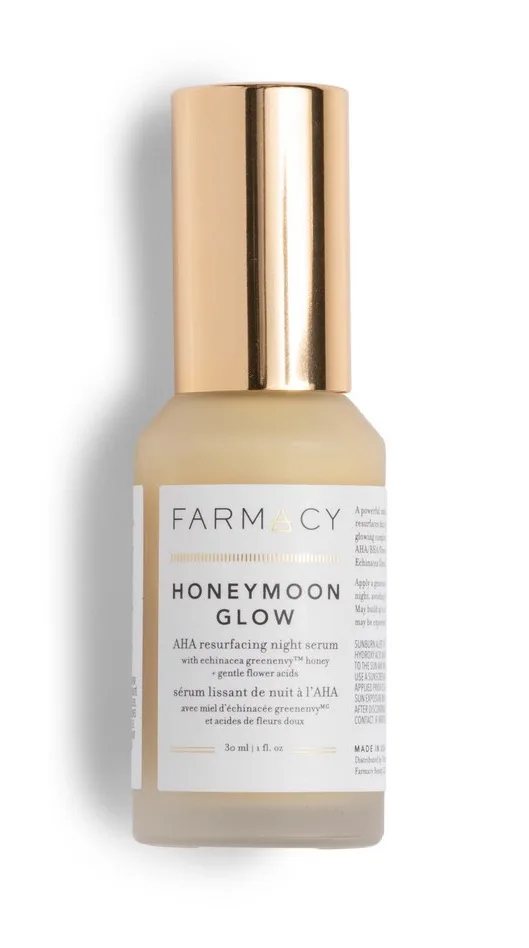 Farmacy Honeymoon Glow AHA Resurfacing Night Serum in opaque glass bottle with gold pump dispenser