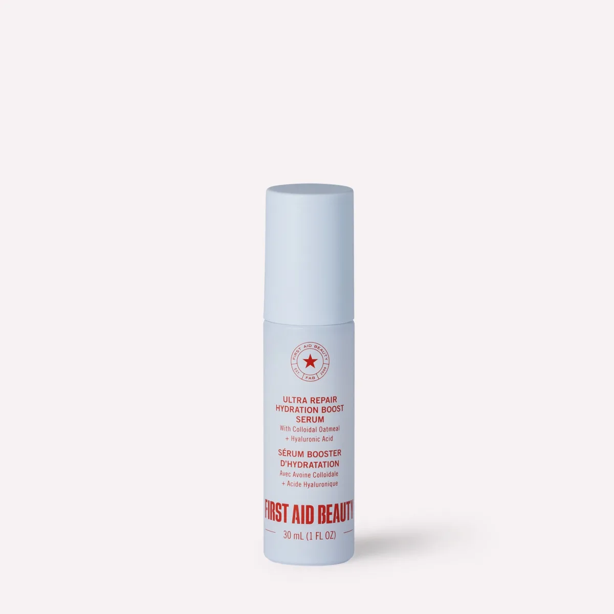 First Aid Beauty Ultra Repair Hydrating Serum in a glass dropper bottle with white and red branding