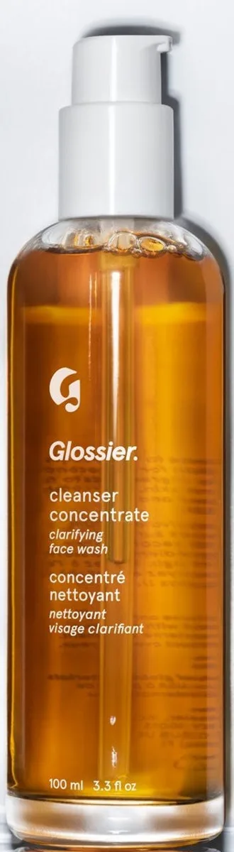 Glossier Cleanser Concentrate exfoliating face wash in a glass bottle with pump dispenser