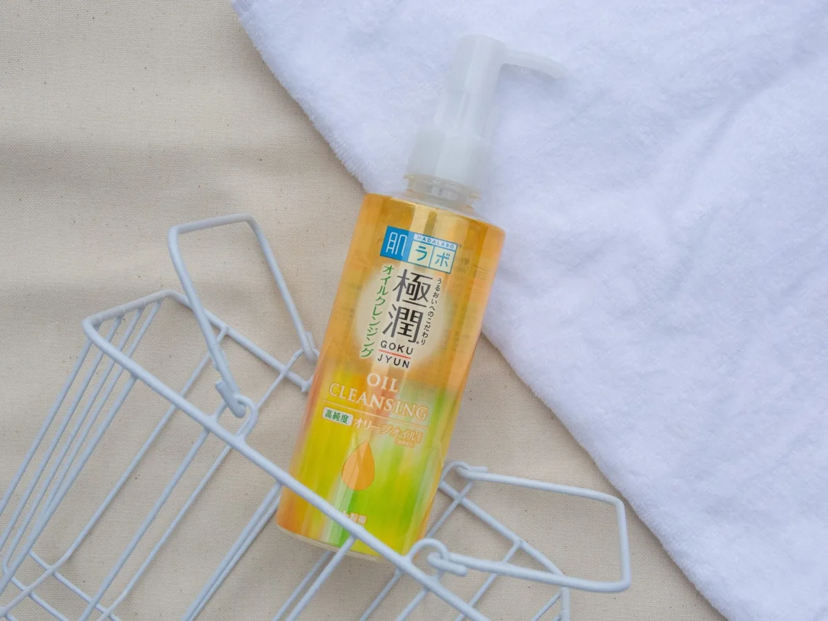 Hada Labo Gokujyun Oil Cleansing in a clear bottle with pump dispenser and orange-accented label