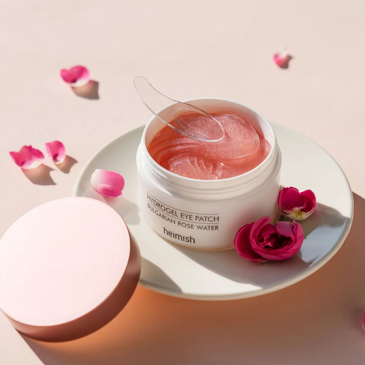 Heimish Bulgarian Rose Water Hydrogel Eye Patch jar with pink hydrogel patches and included spatula