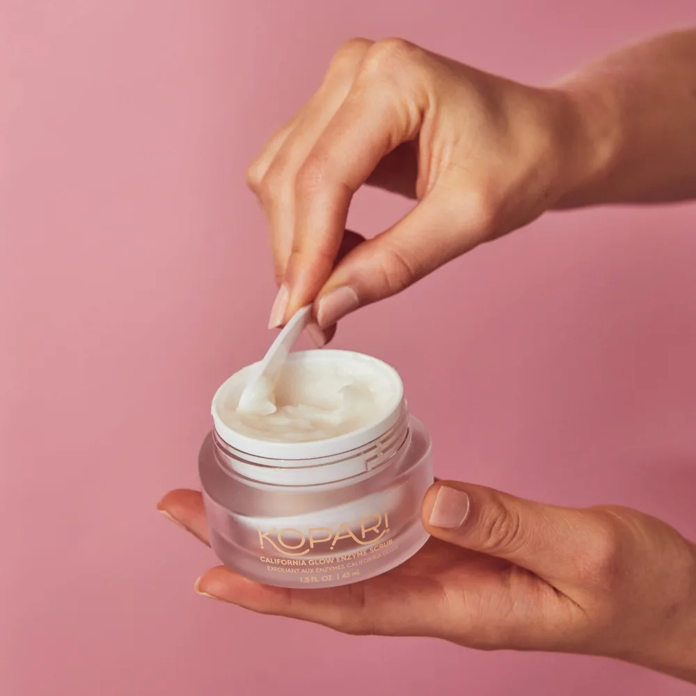 Kopari California Glow Enzyme Face Scrub in a small tube with tropical-inspired packaging