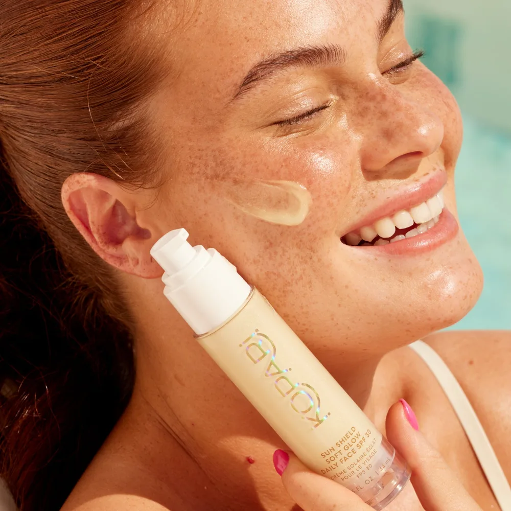 Kopari Sun Shield Soft Glow Daily Face SPF 30 in a small white squeeze tube with clean minimalist design