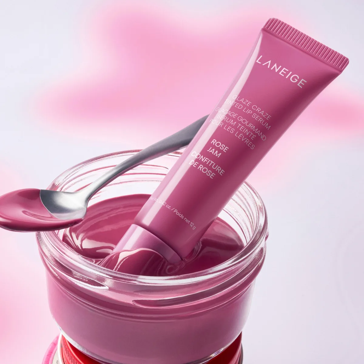 Laneige Glaze Craze Tinted Lip Serum in a slim pink gradient tube with donut applicator