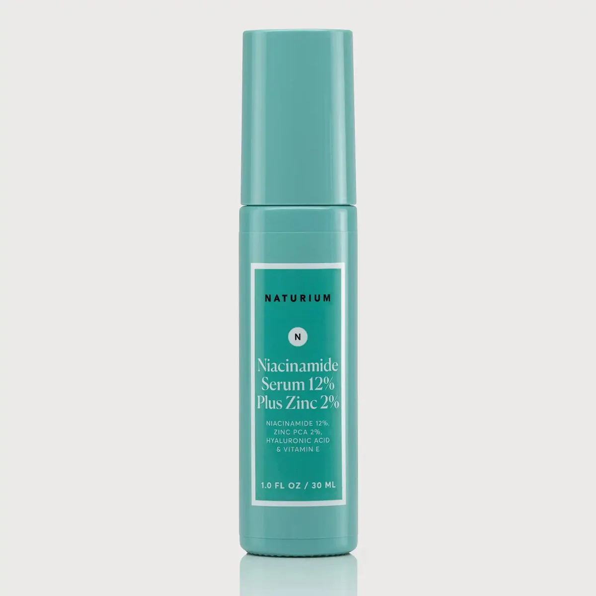 Naturium Niacinamide Serum 12% Plus Zinc 2% glass dropper bottle with minimalist white and green label