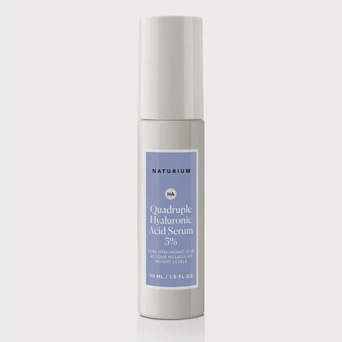 Naturium Quadruple Hyaluronic Acid Serum 5% glass dropper bottle with minimalist white and green label