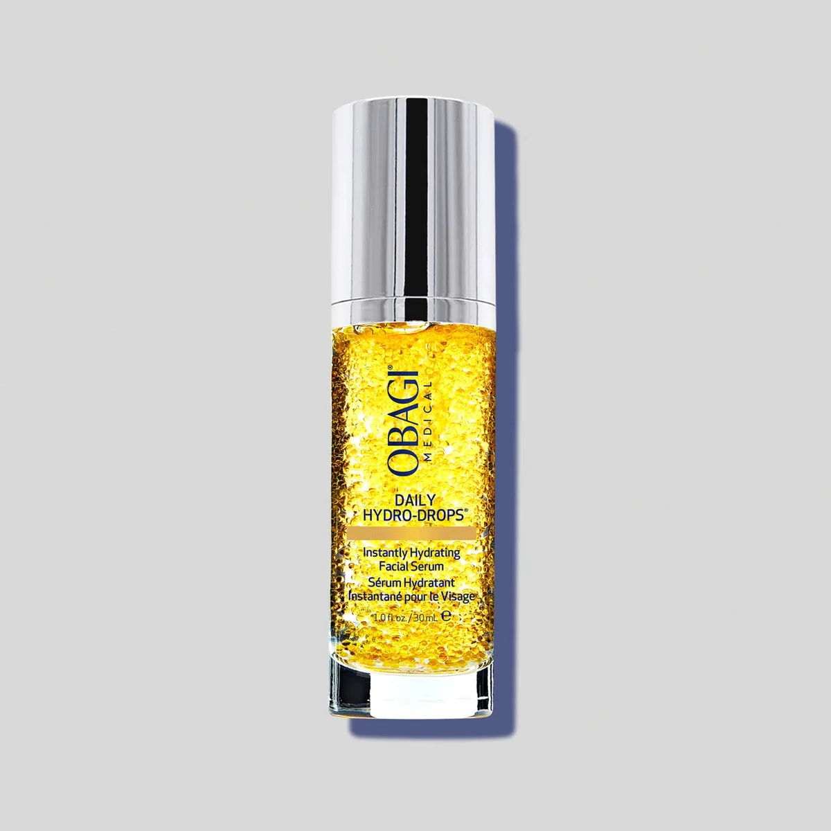 Obagi Daily Hydro-Drops Facial Serum glass bottle with visible suspended droplets and pump dispenser