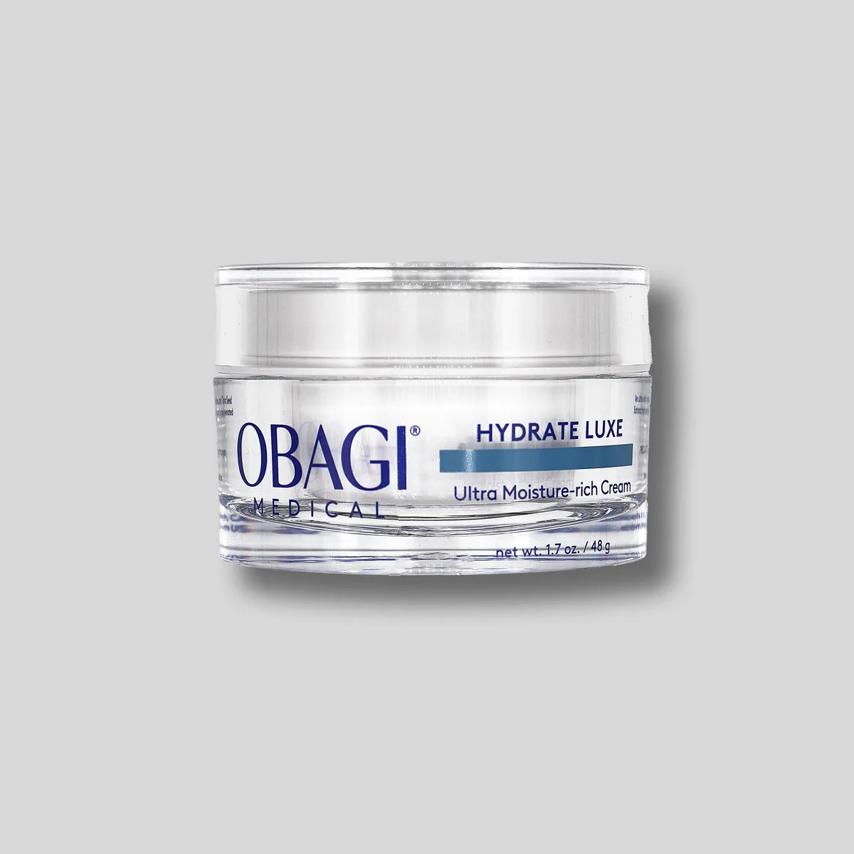 Obagi Hydrate Luxe Moisture-Rich Cream frosted glass jar with silver lid and blue Obagi branding