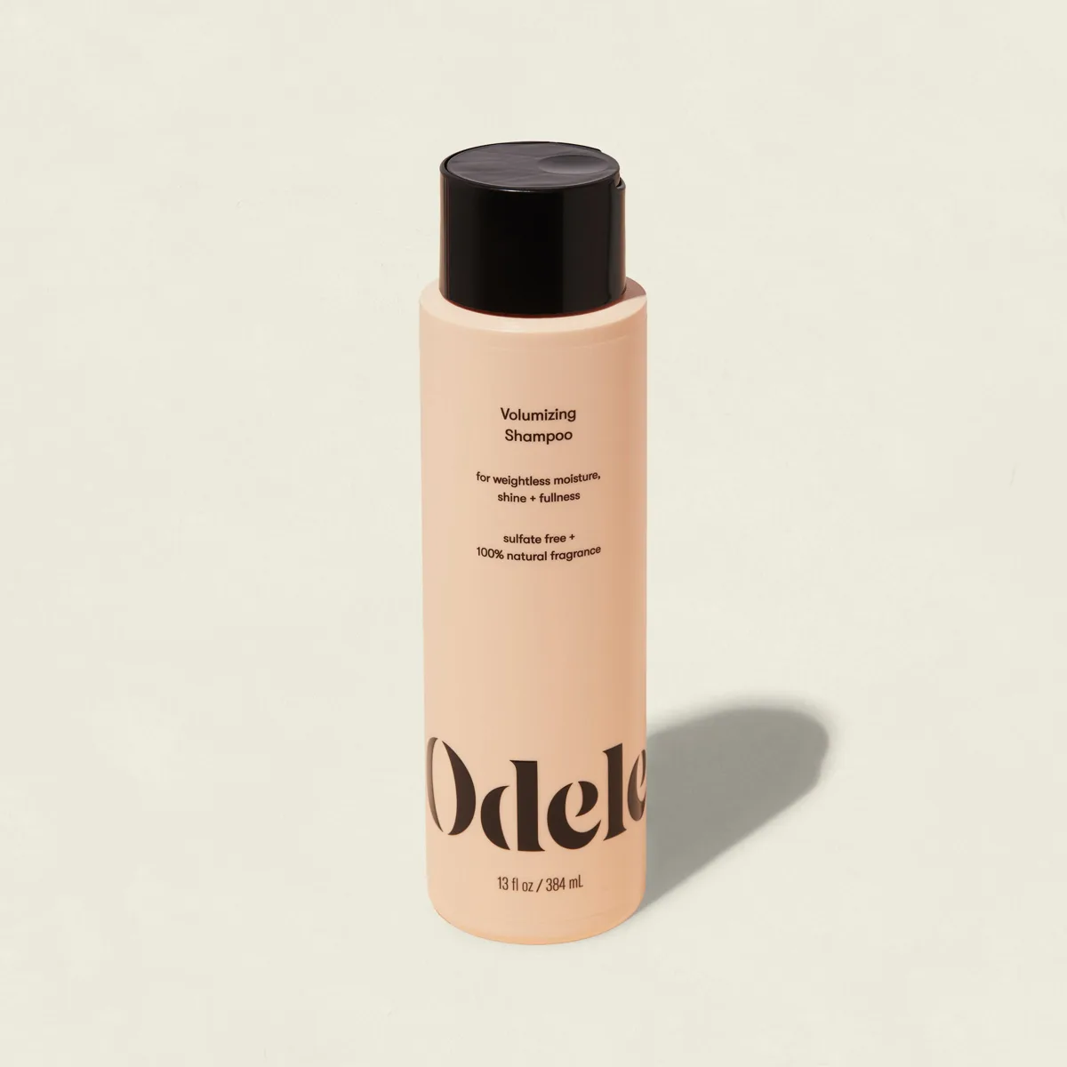 Odele Volumizing Shampoo in white bottle with flip-top cap