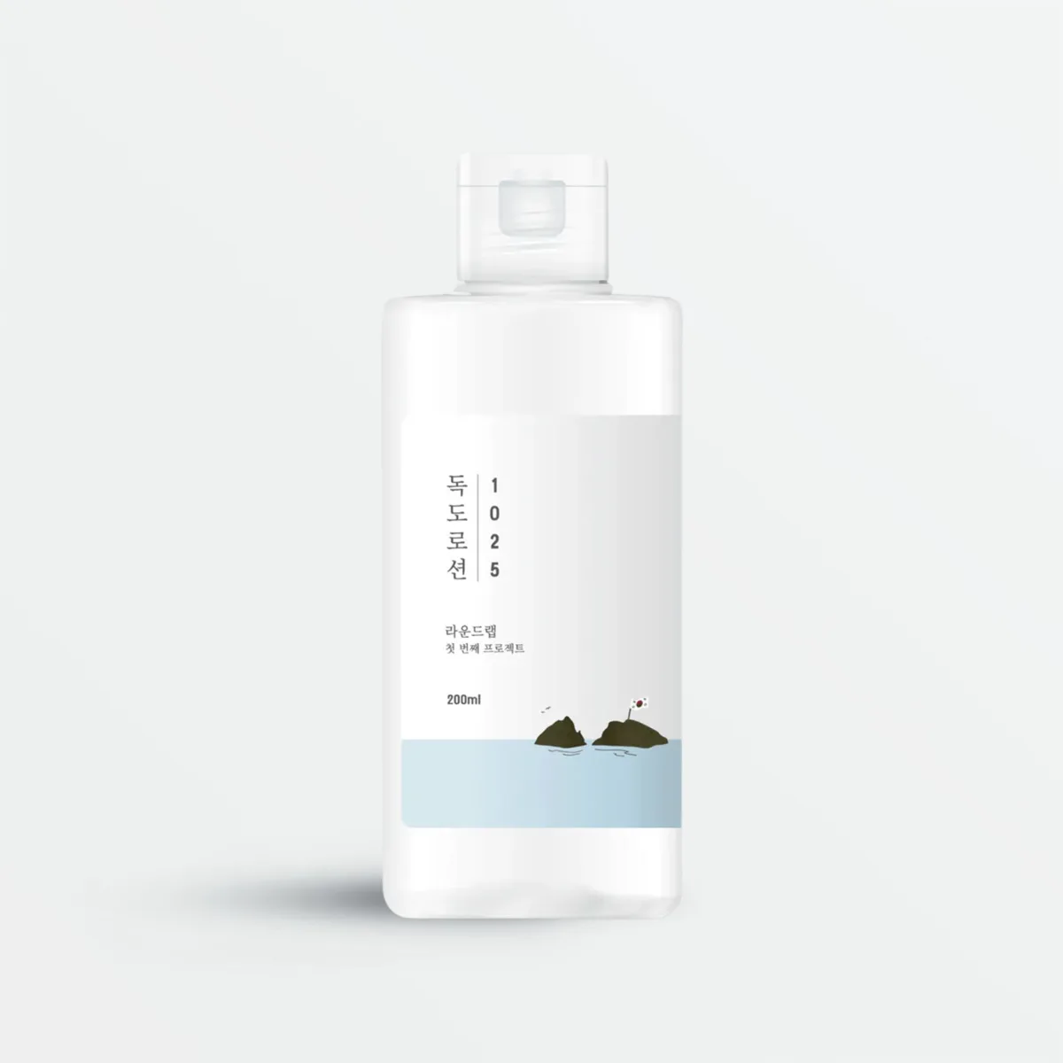 Round Lab Dokdo Lotion in a tall white plastic pump bottle