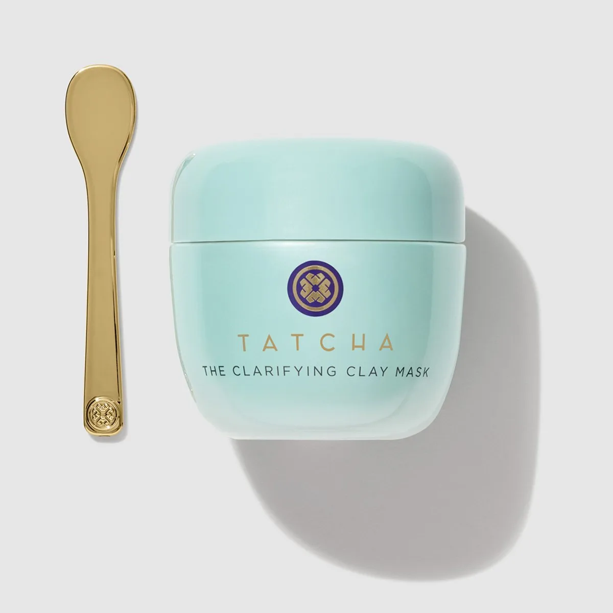 Tatcha The Clarifying Clay Mask in a sage-green glass jar with gold lid