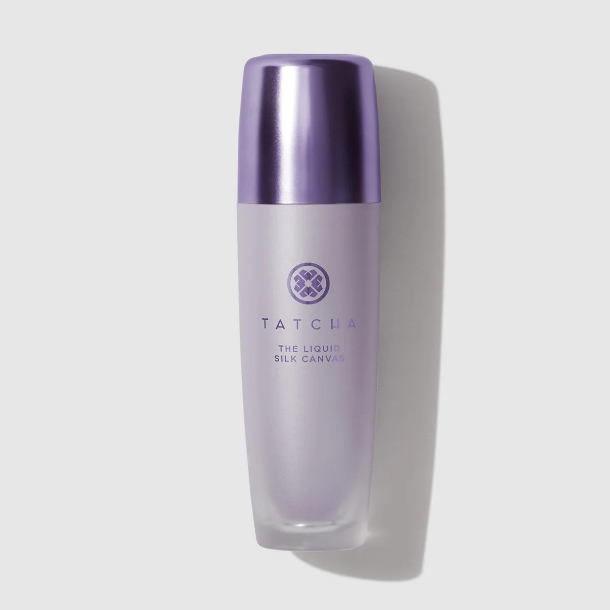 Tatcha The Liquid Silk Canvas primer in a frosted glass bottle with gold pump